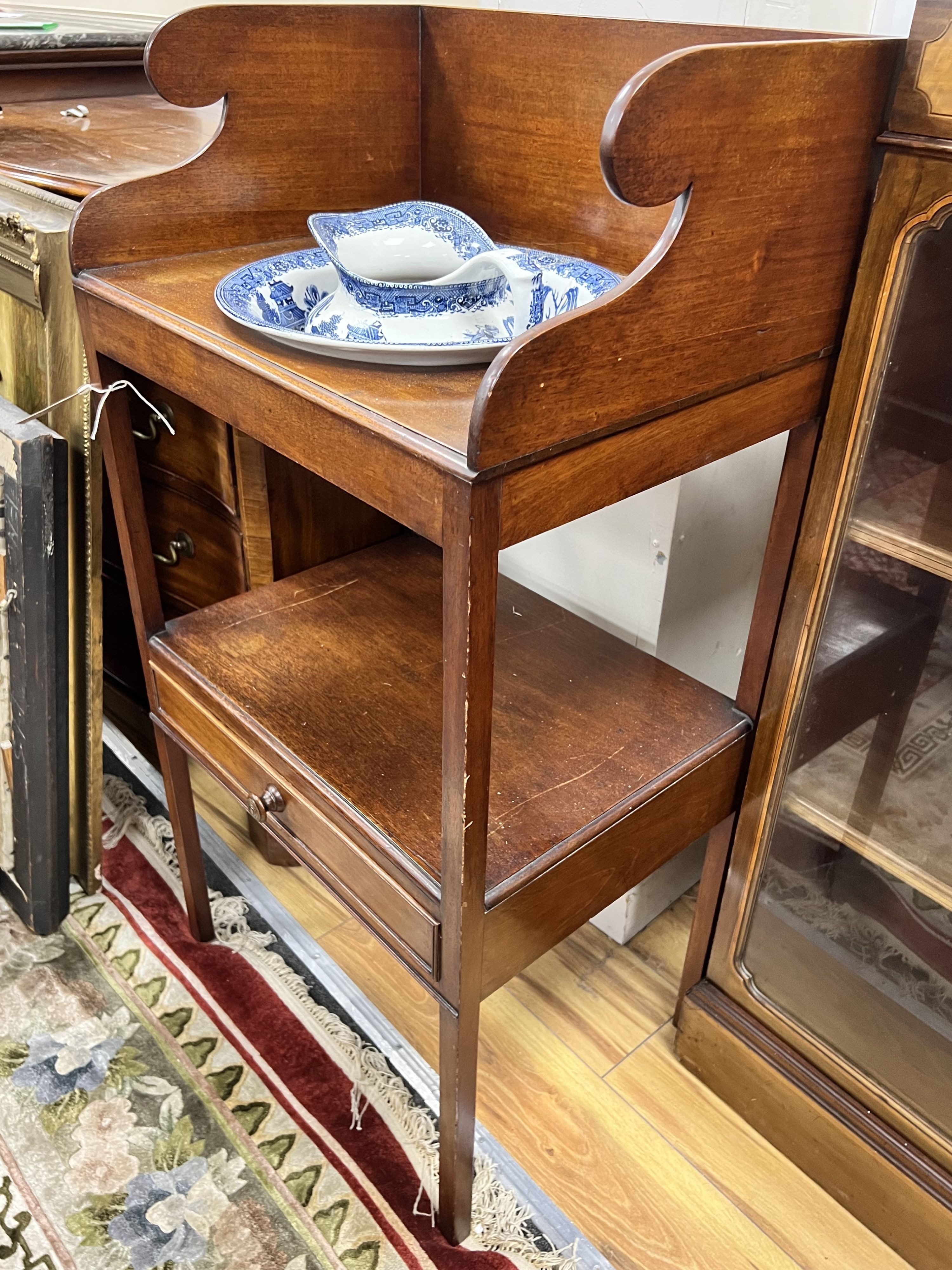 A Regency mahogany two tier washstand, together with a Staffordshire blue and white jug and basin, width 50cm depth 38cm height 101cm